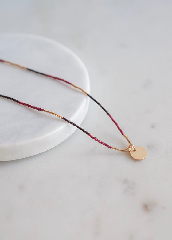 Debbie Fisher | Dark Brown + Red Seed Charm Necklace