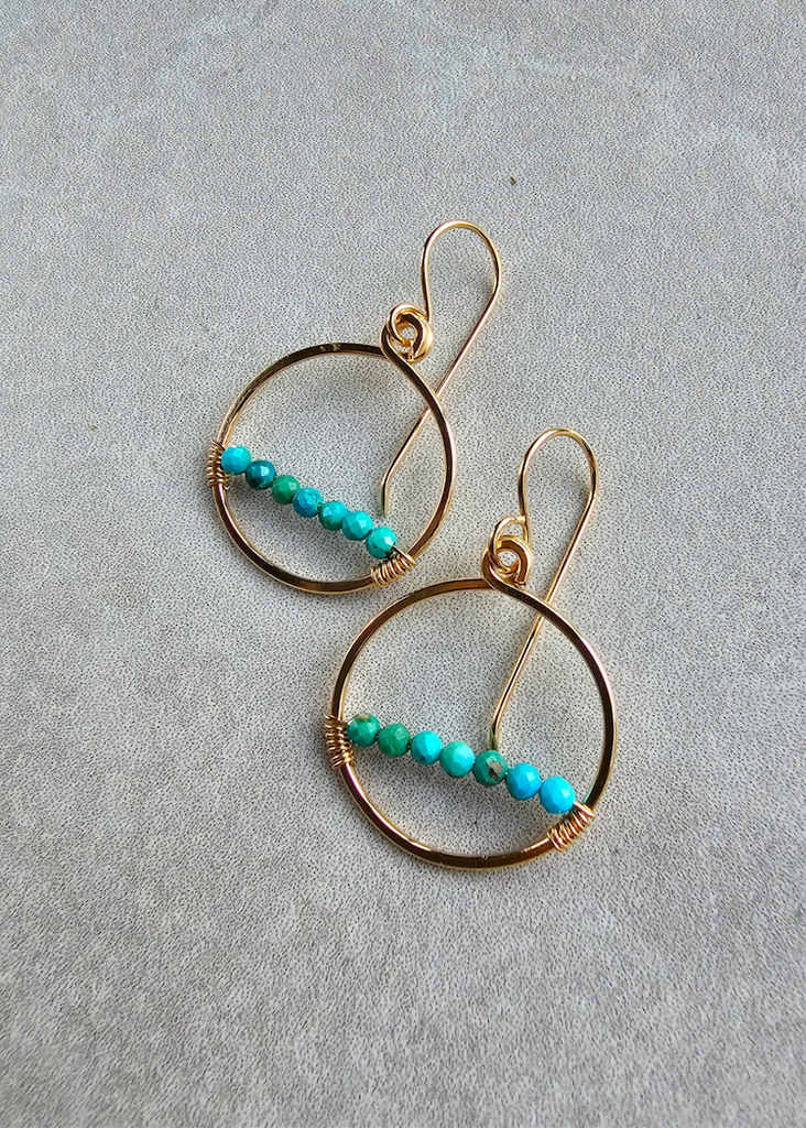 When you want a little earring with a little punch…of color. This hoop is a little shy of 1 inch and has a single row of tiny, faceted gem stones.